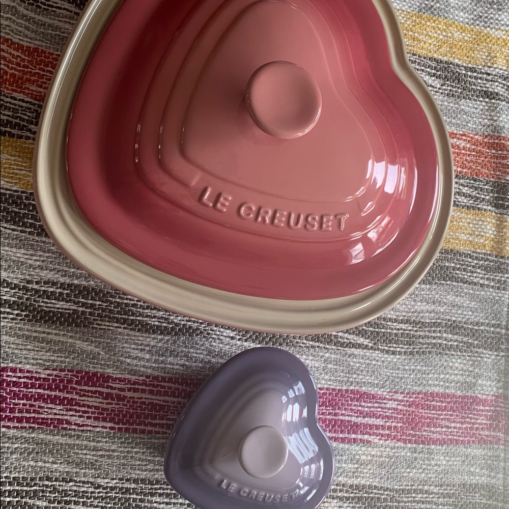 Le Creuset Heart shaped casserole dish in pink and matching purple ramekin .
